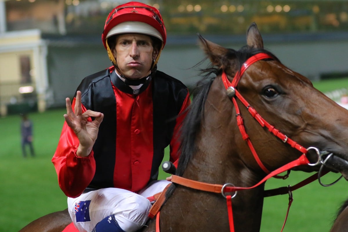 Jockey Hugh Bowman gives his trademark salute after winning on Country Star at Happy Valley. Photos: Kenneth Chan