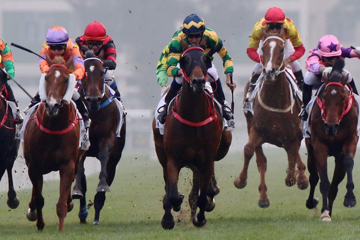 Hugh Bowman (blue, green and yellow silks) wins the Classic mile with Furore. Photos: Kenneth Chan