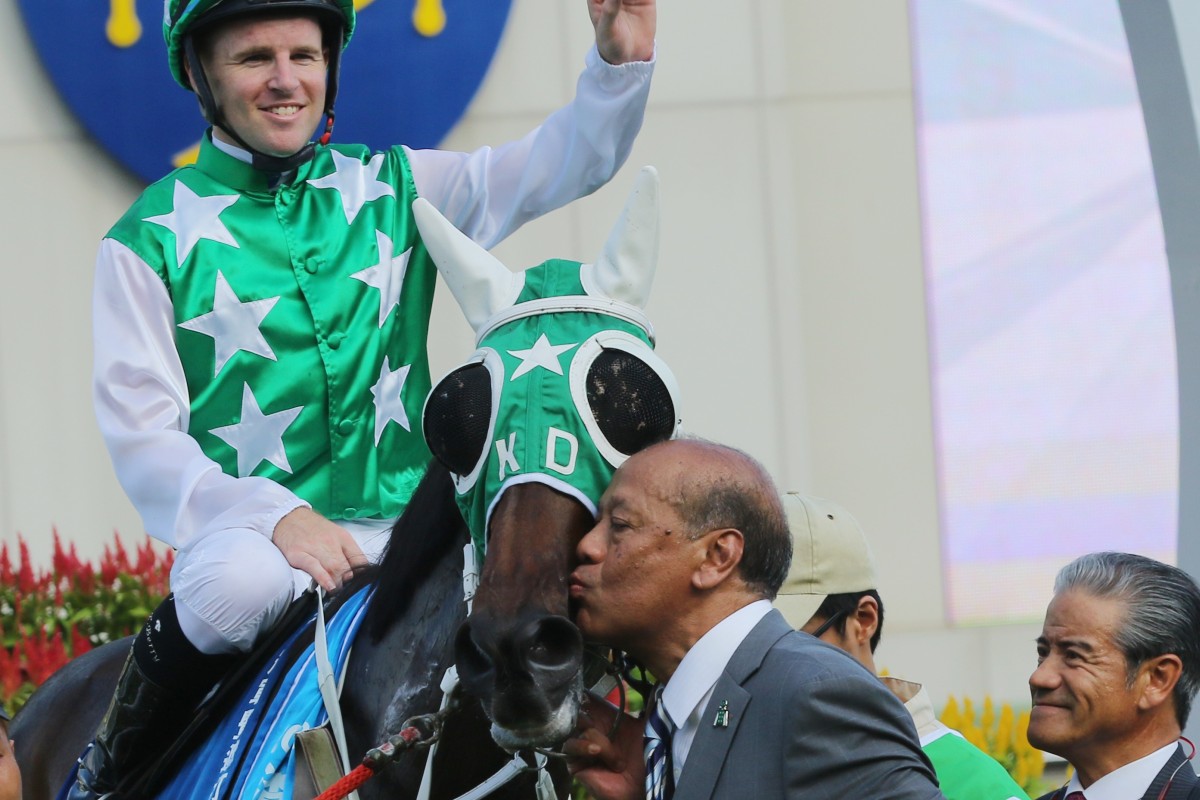 Owner Kerm Din kisses Pakistan Star after the Standard Chartered Champions & Chater Cup (2,400m) at Sha Tin last year as former trainer Tony Cruz looks on. Photos: Kenneth Chan