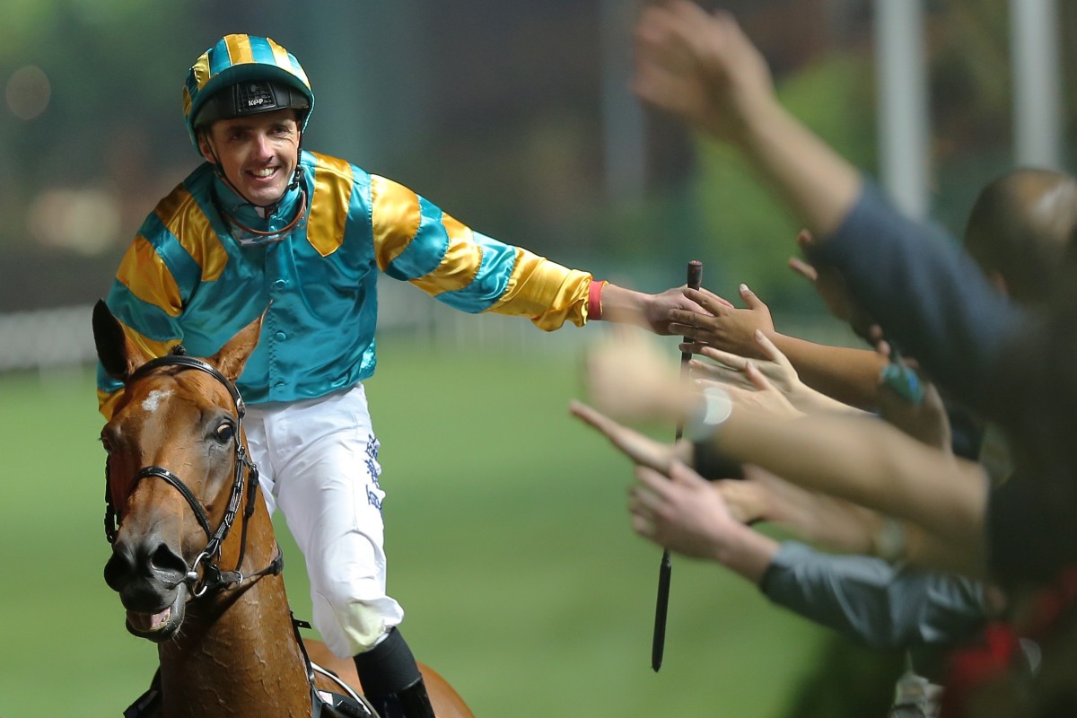 Martin Harley high fives the crowd after winning on Wednesday night. Photos: Kenneth Chan